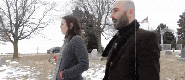 Angelica and James walking in the cemetery