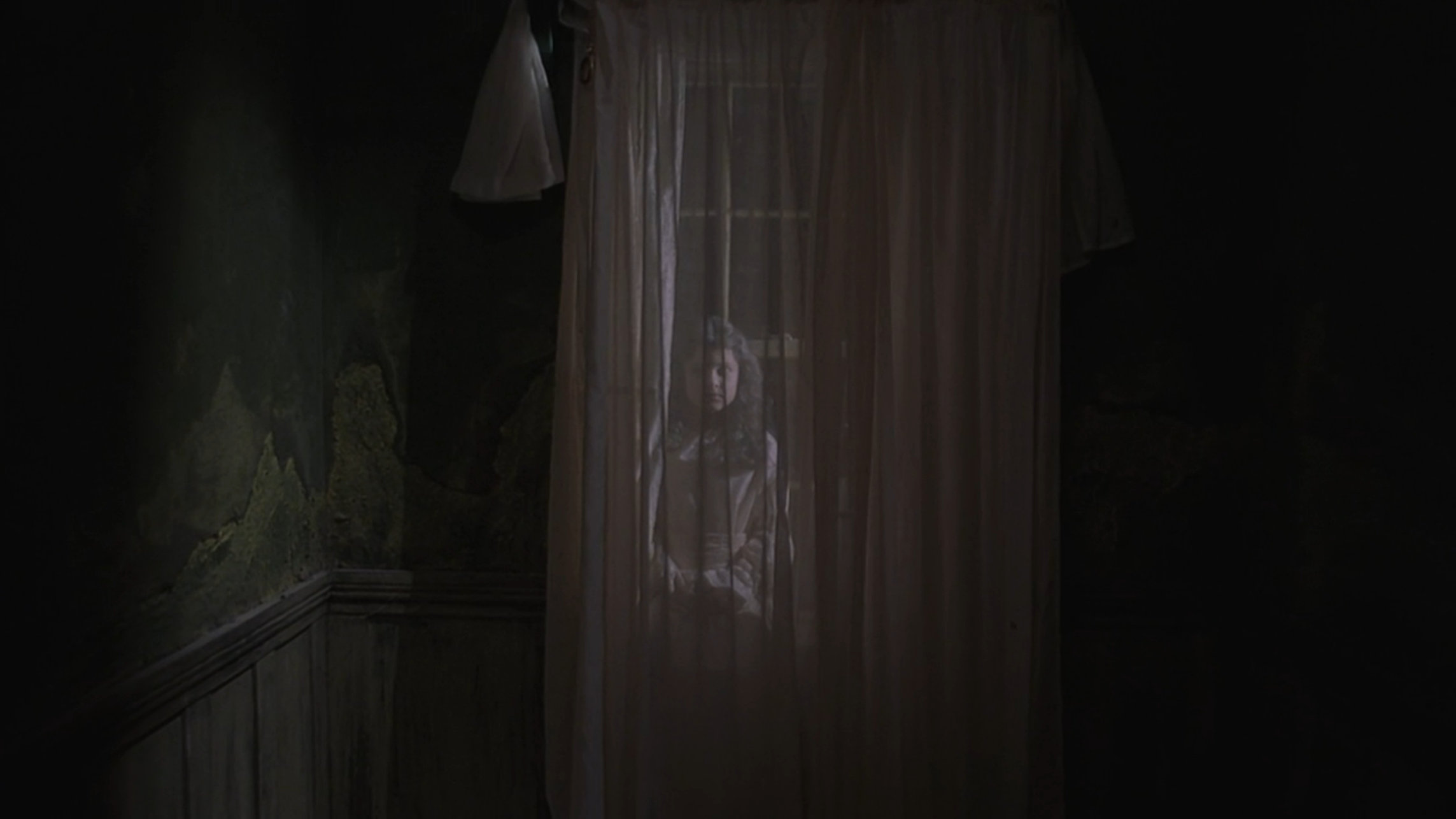 Creepy ghost girl behind some curtains