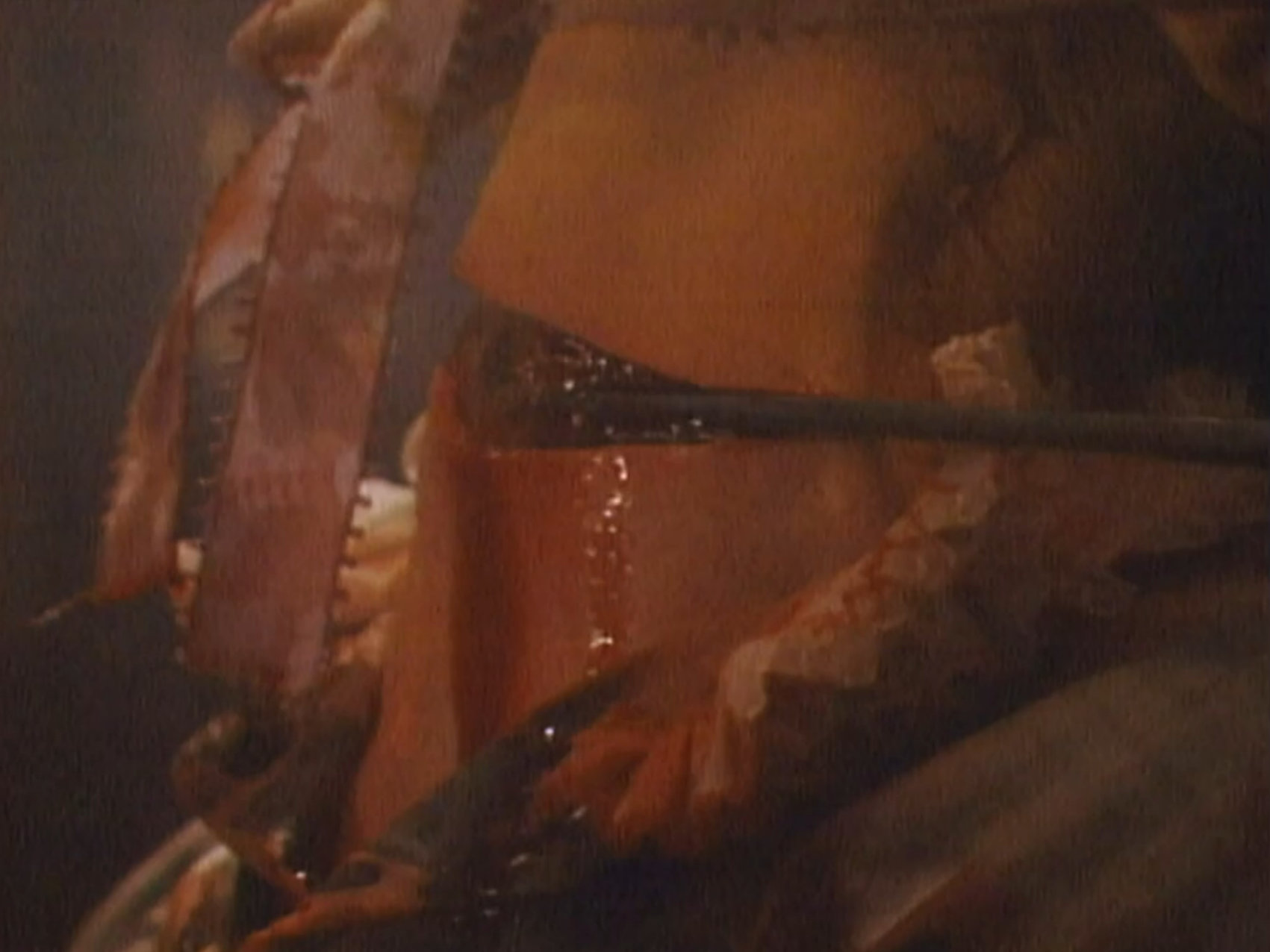 One of the victim's neck getting cut