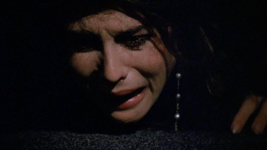 One of the gals hiding under a bed