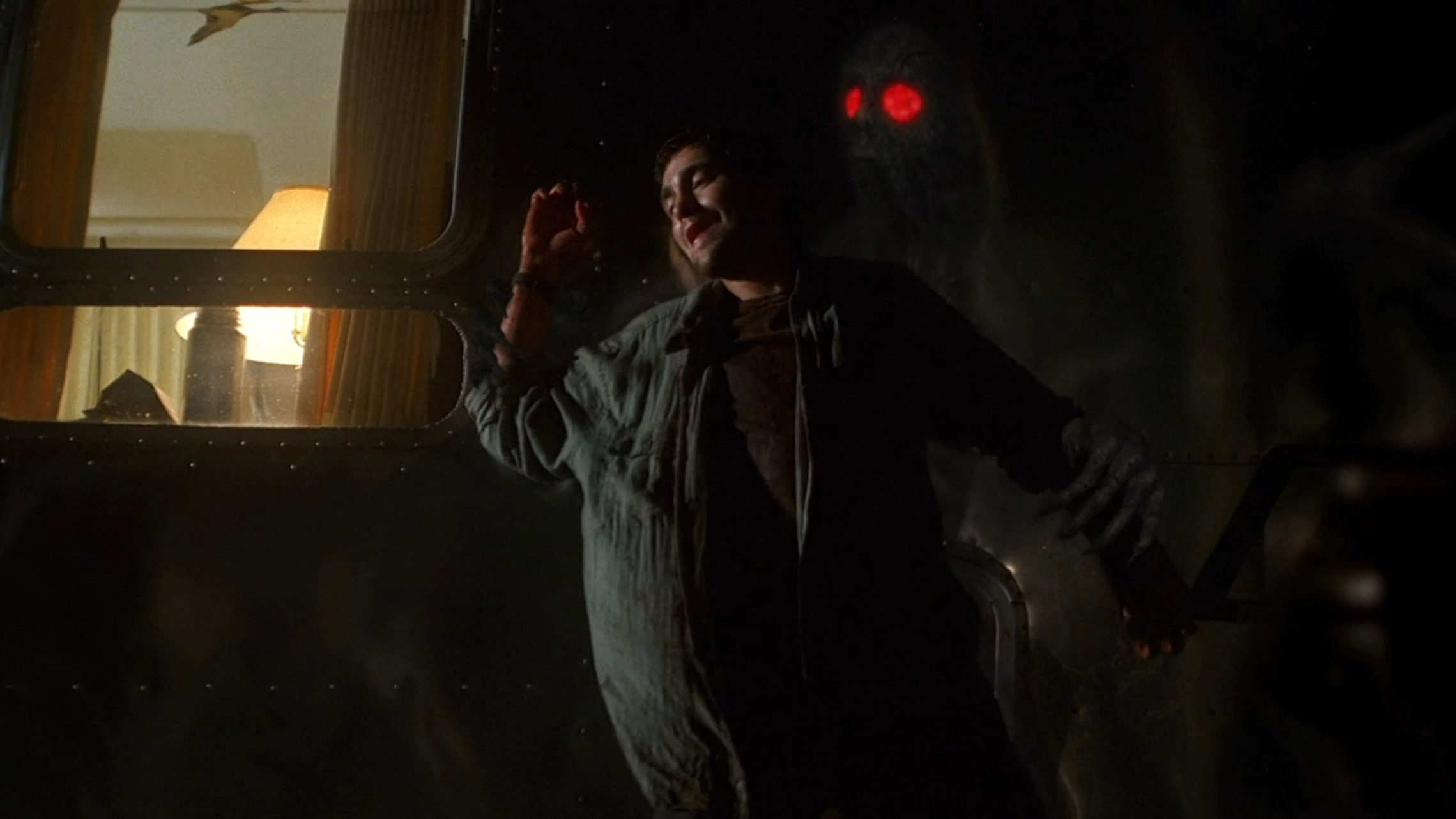 Mothman sucking a guy into an RV