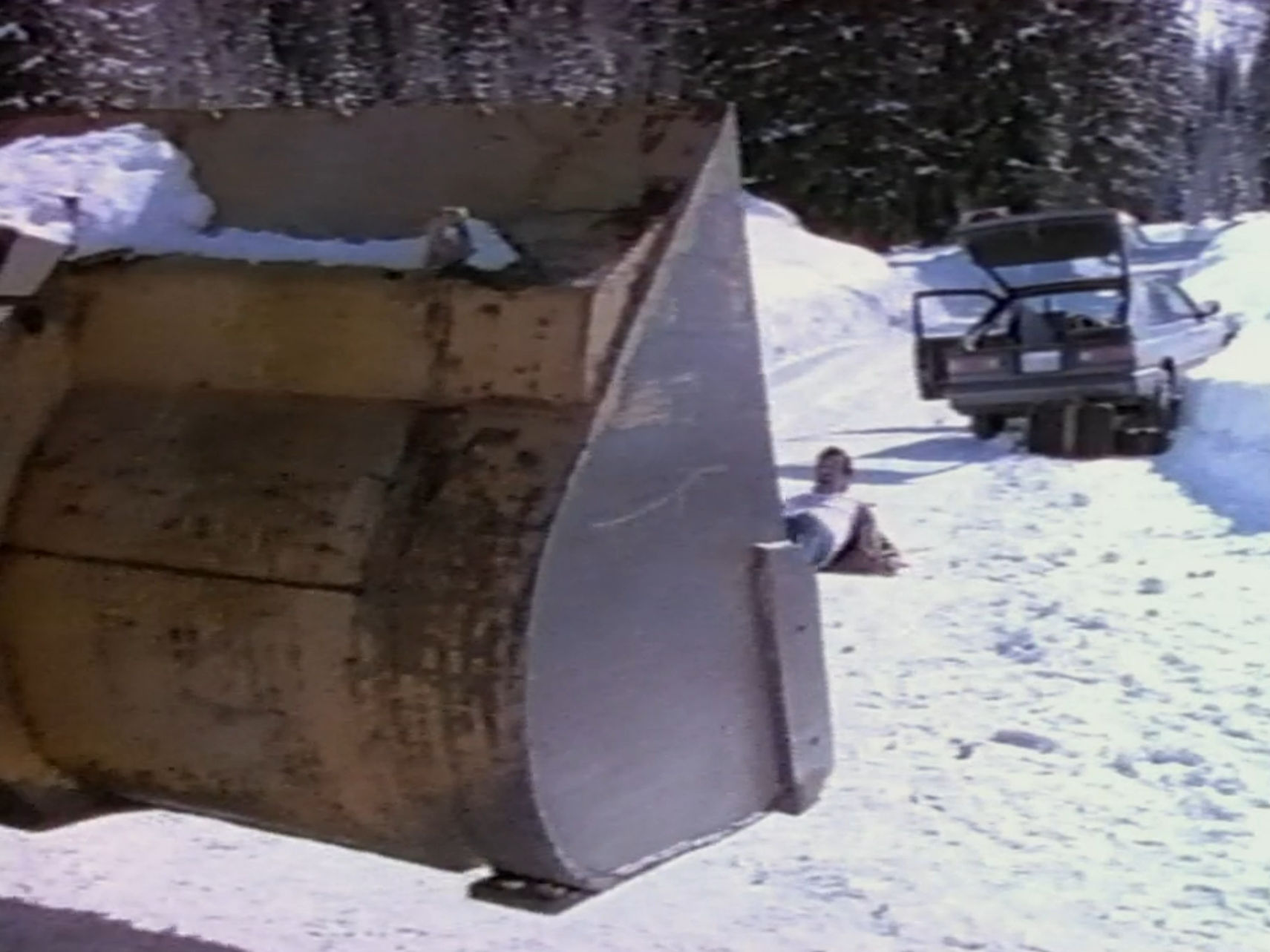 Eddie lying in the road like an idiot, waiting for the snowplow to slowly run over him