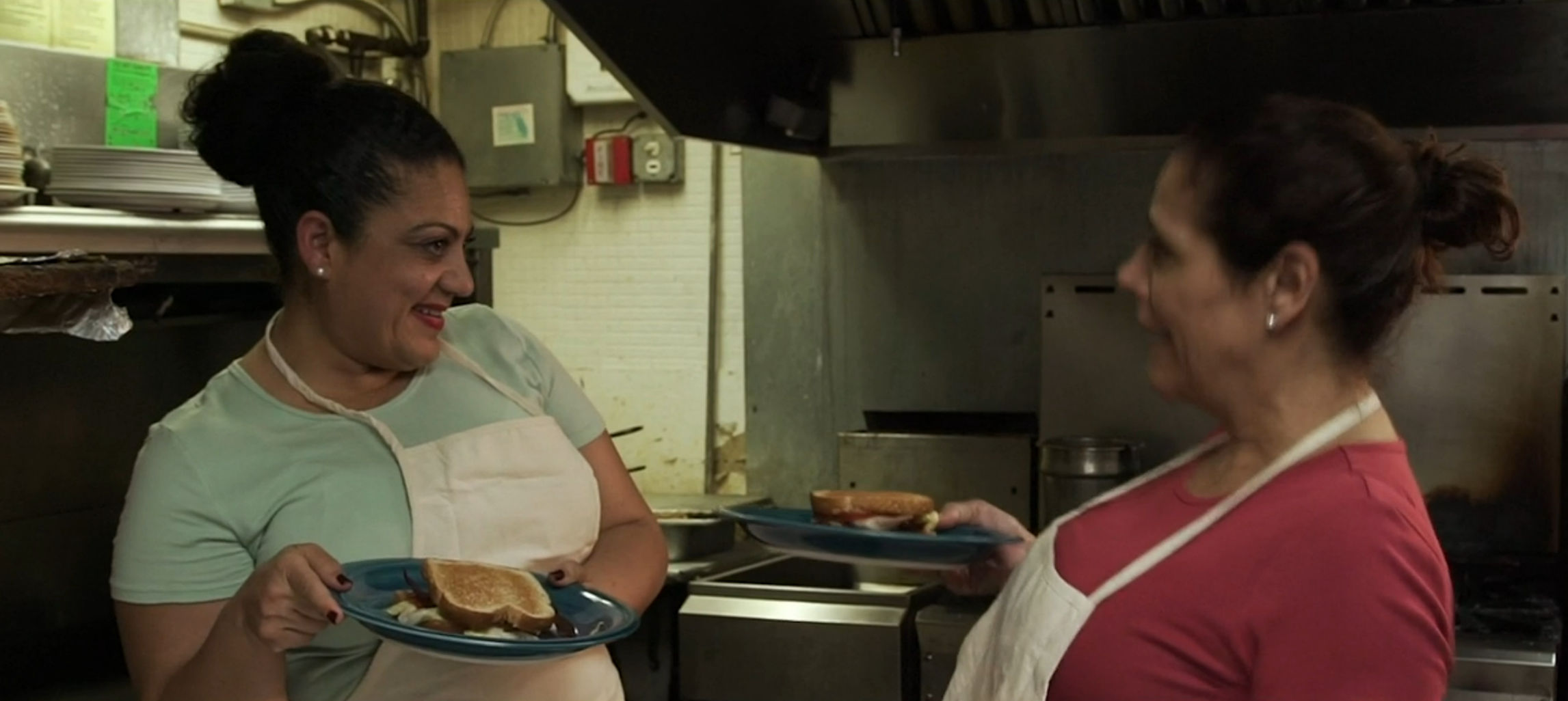 Two of the cooks from the diner having fun before the killers show up