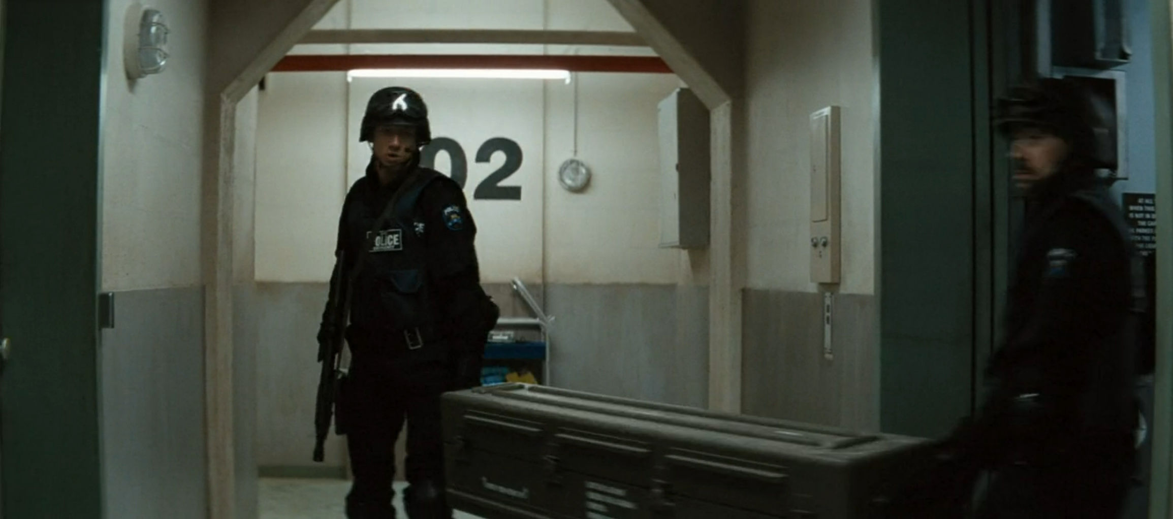 S.W.A.T. guys taking explosives to the roof...for some reason