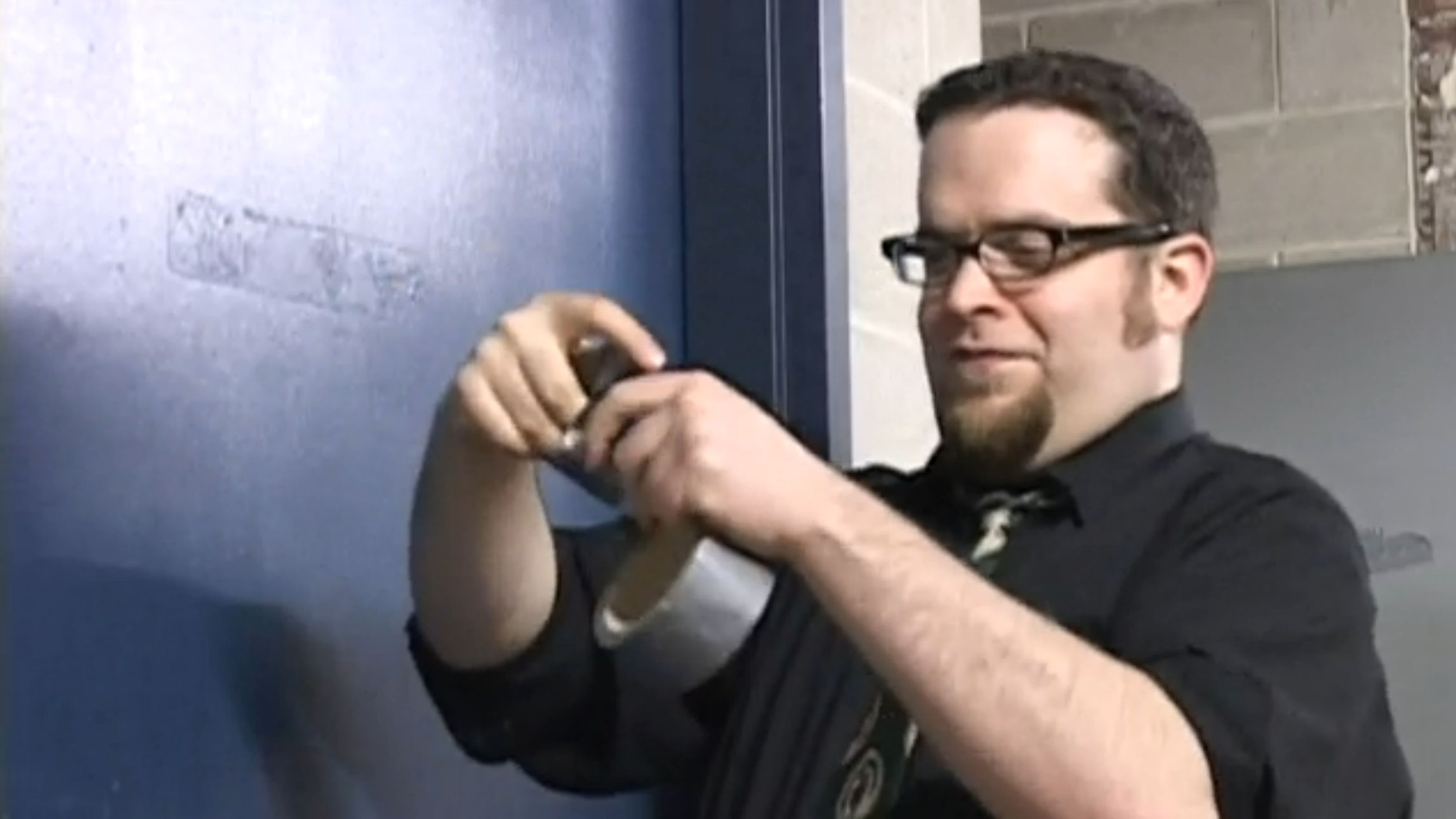 Ben trying to figure out the complexities of tape