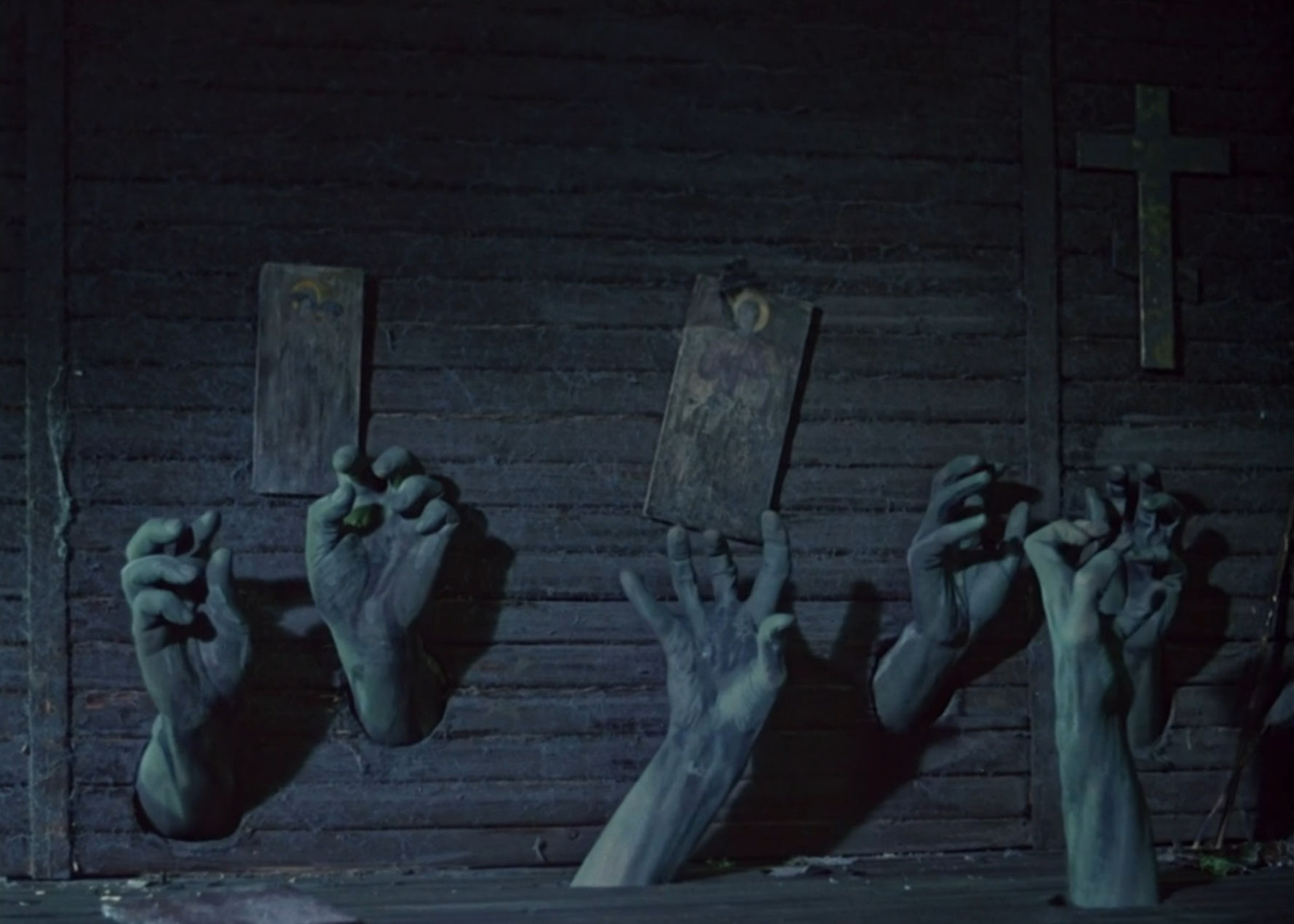 Hands rising up from the floor