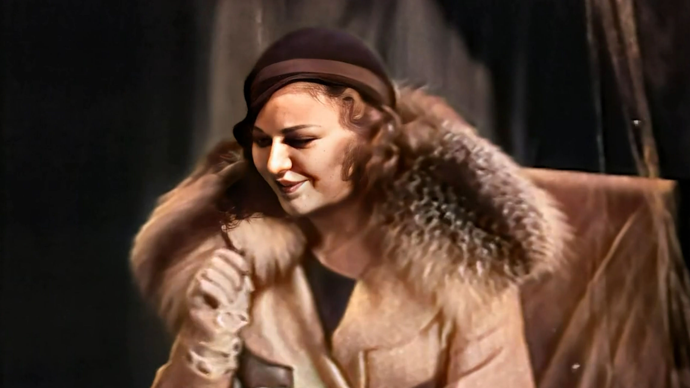 Marie still reminiscing, only this time in color and cropped closer