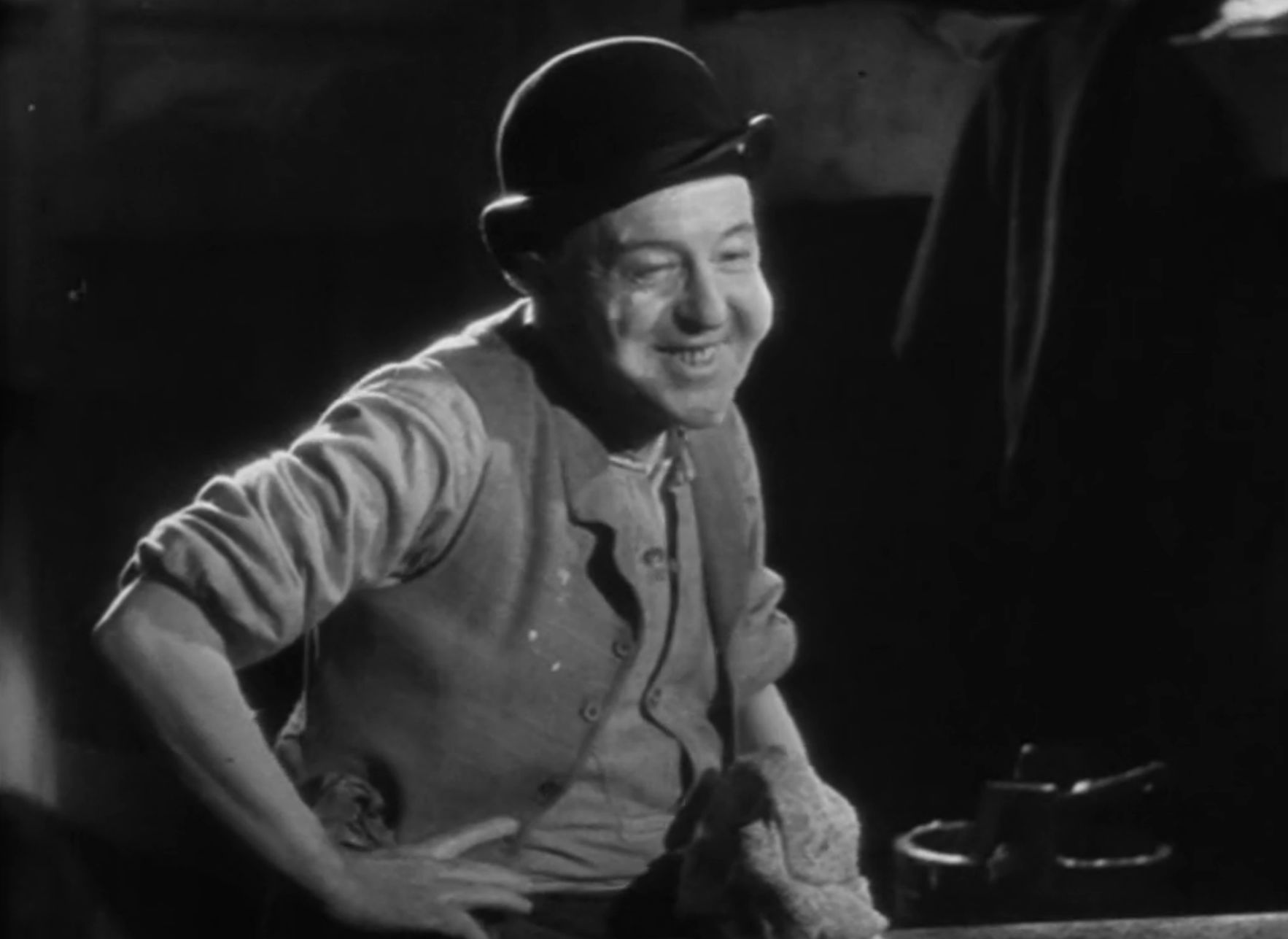 The cook, distinguishable only by his hat