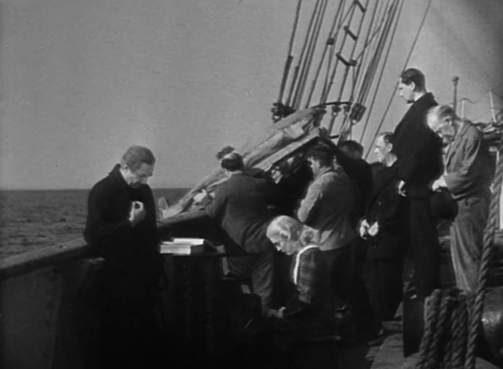 The crew holding a burial at sea