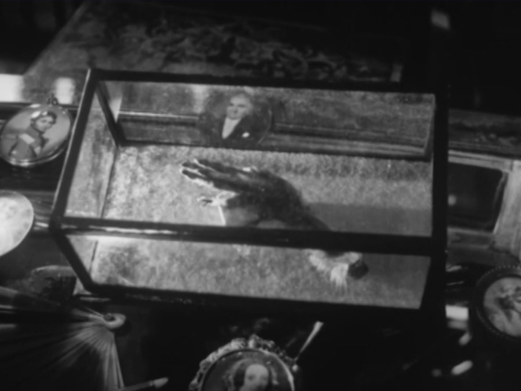 The Monkey's Paw under glass
