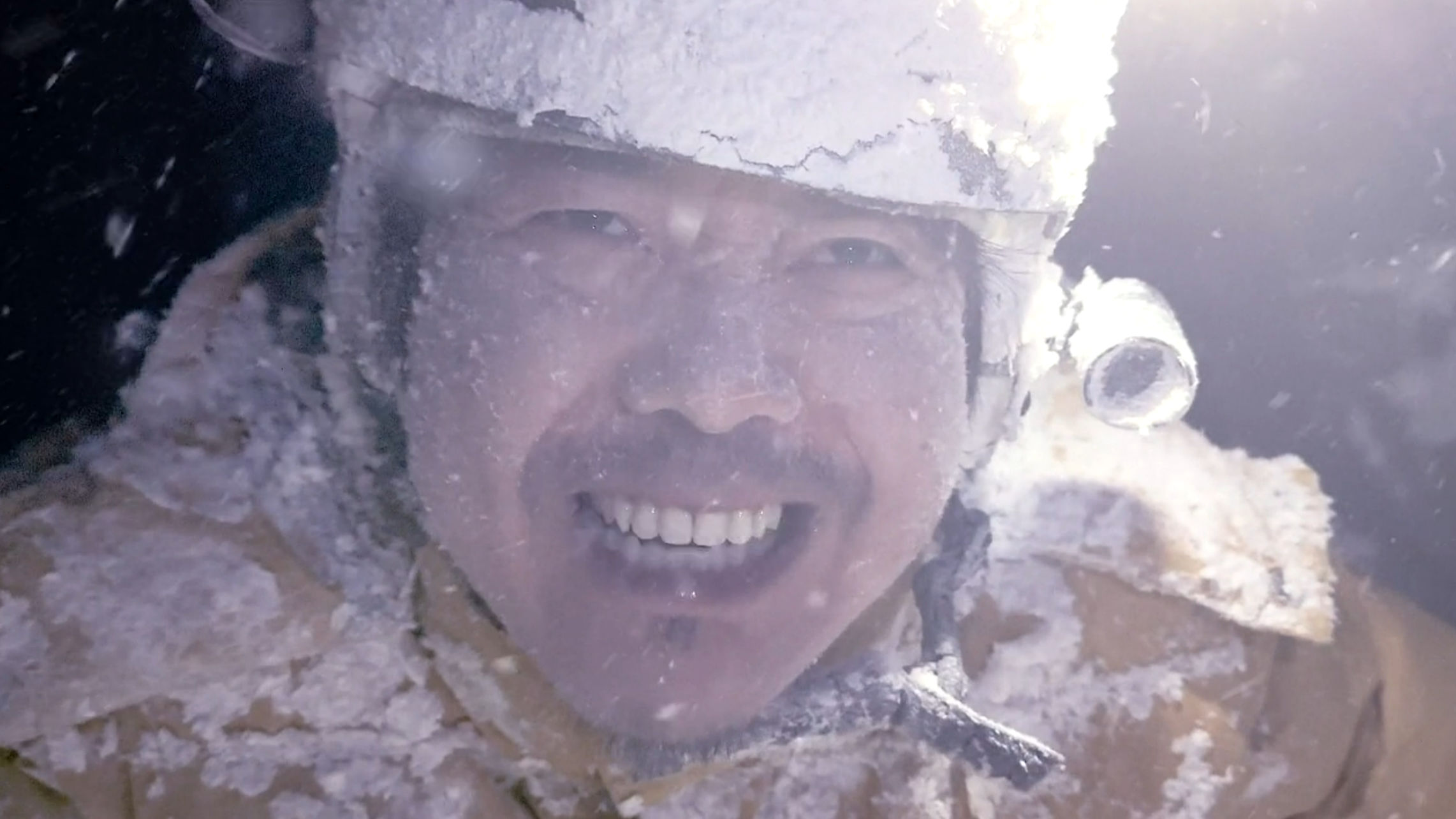 Sato looking suspiciously happy