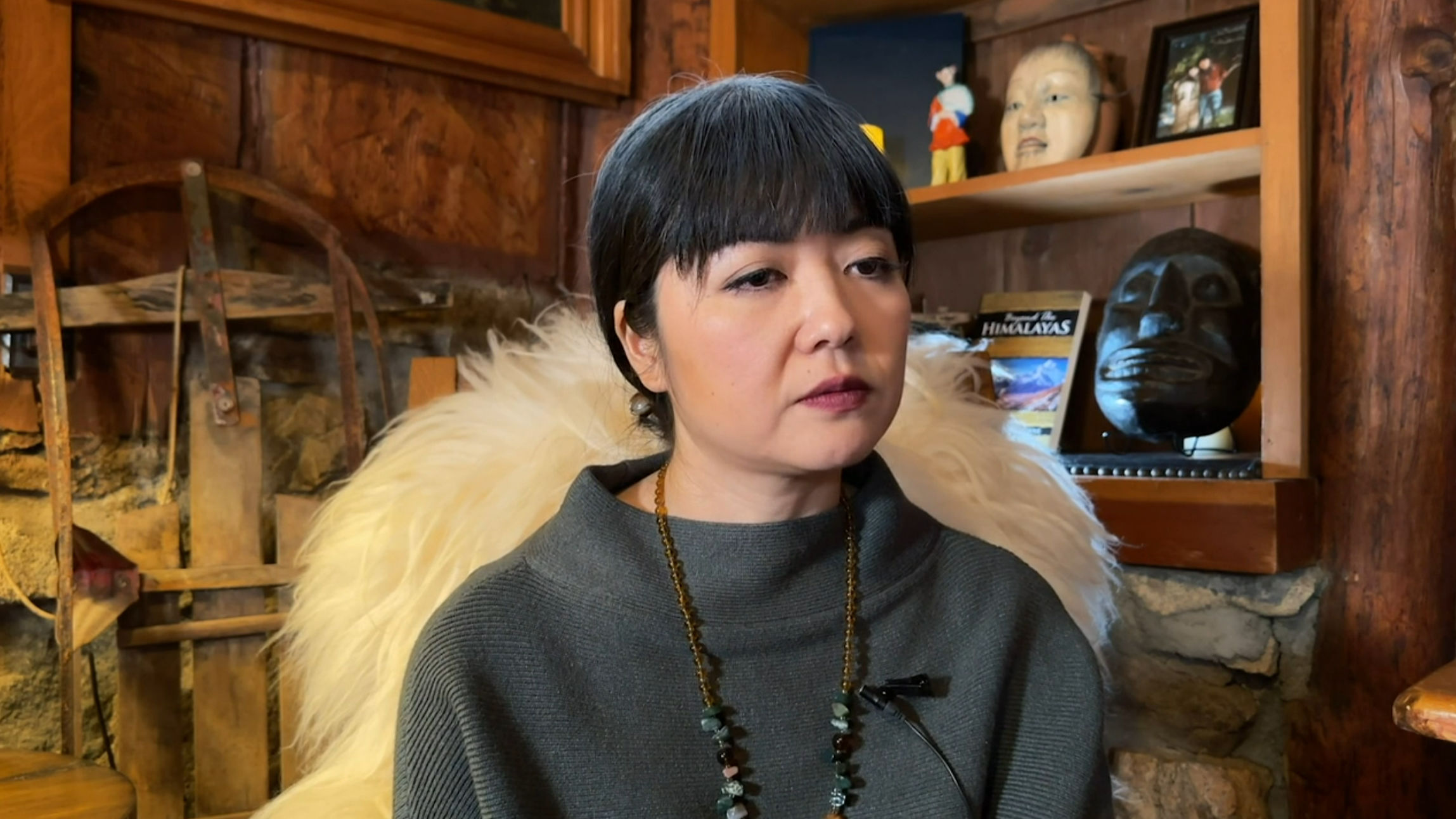 Mrs. Sato looking severely disinterested