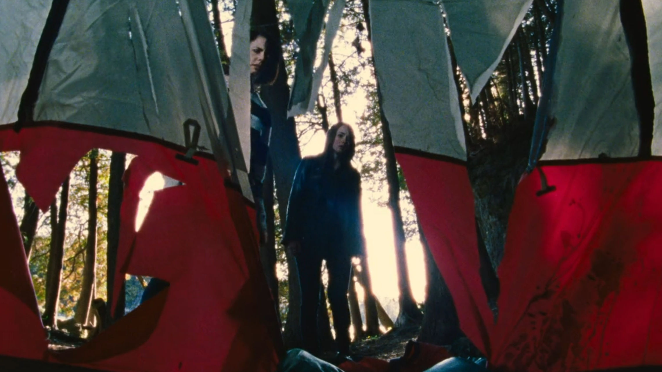 The family discovering the mangled tent