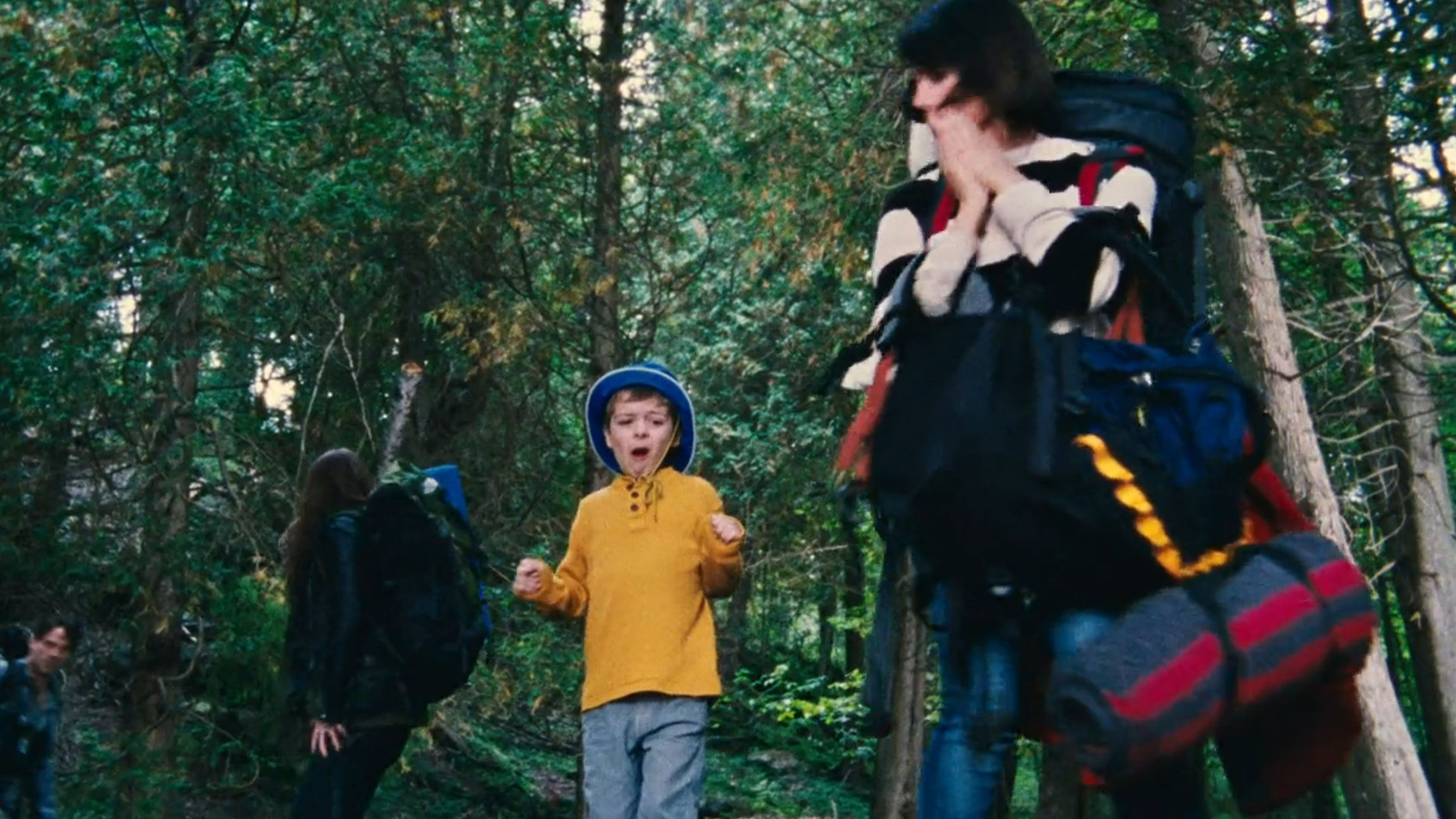 The son with a strange look of surprise on his face
