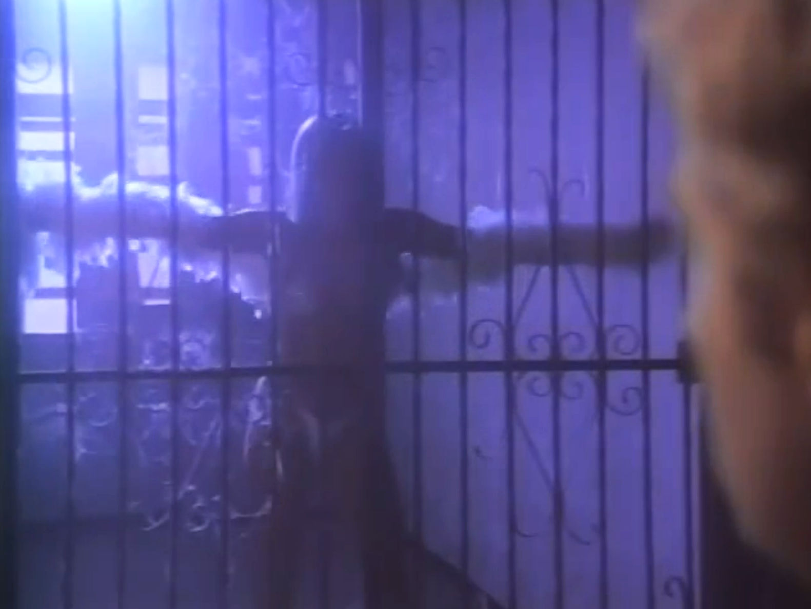 A stripper behind a gate