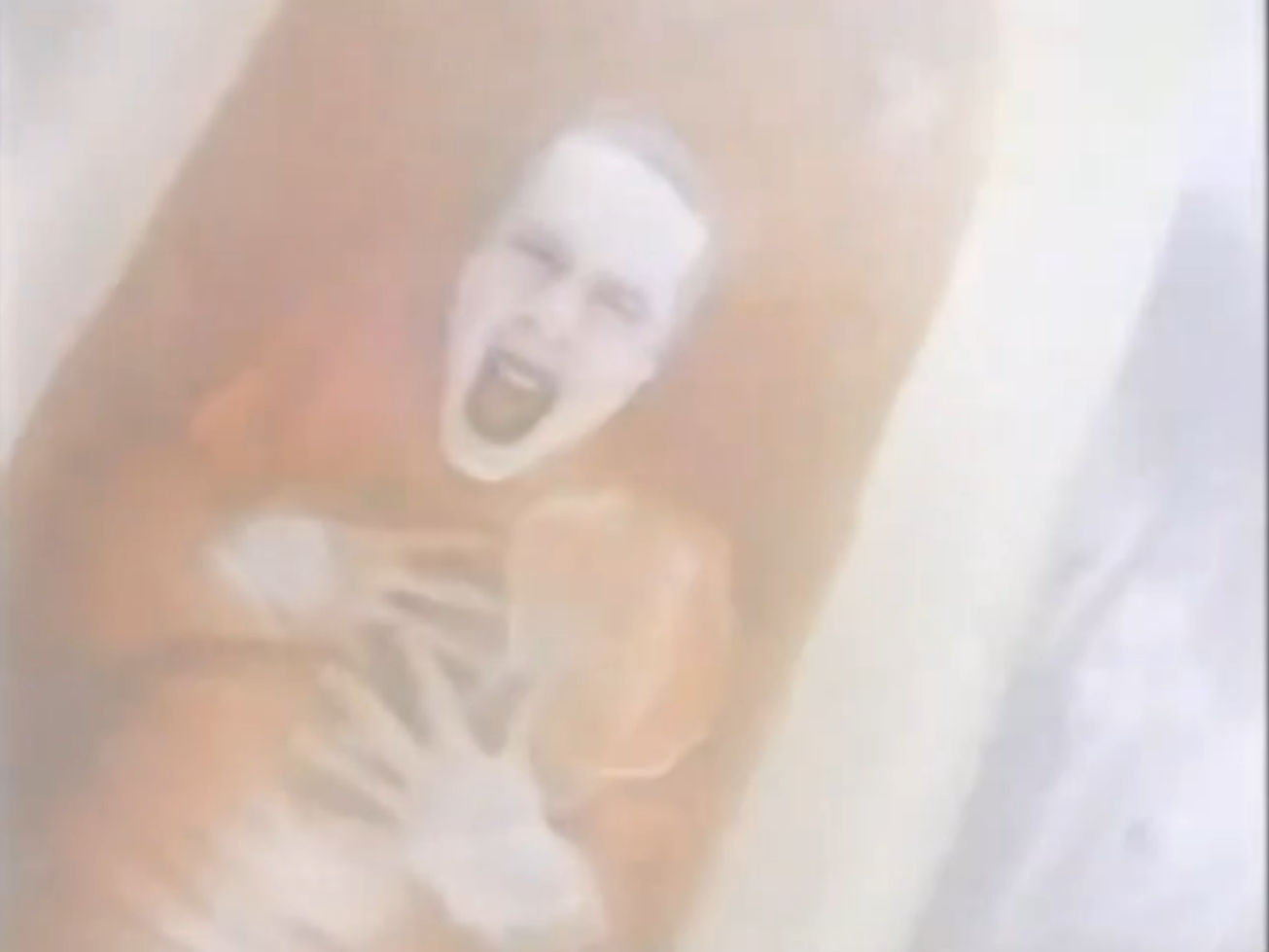 Some guy in a bloody bathtub