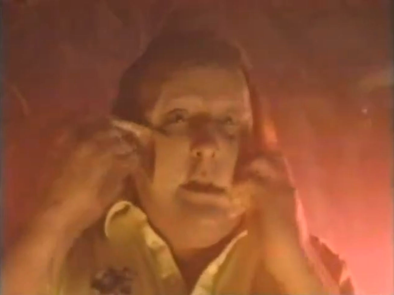 Plumber-boy tearing at his face