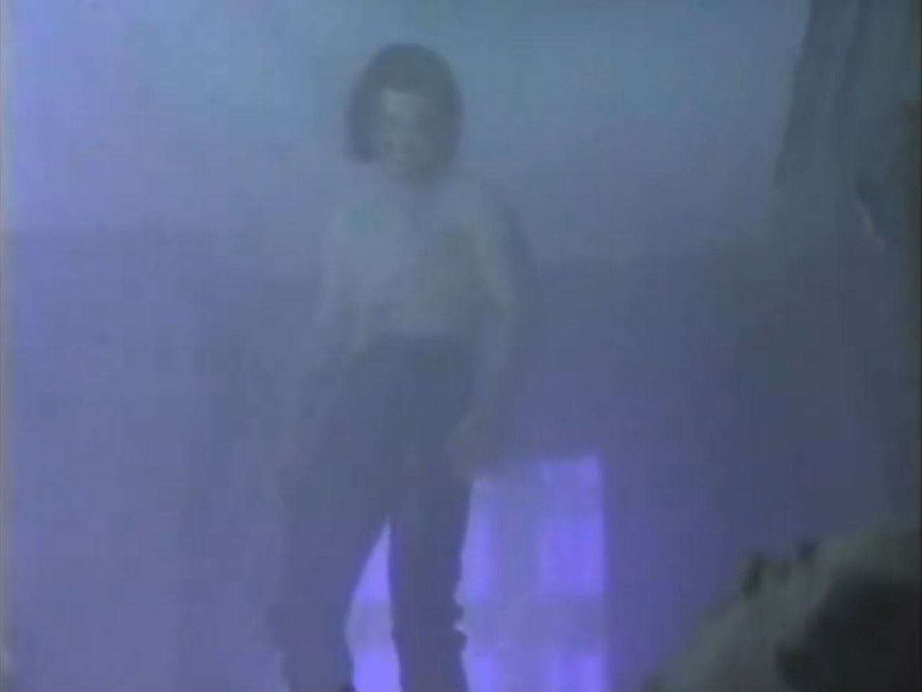 Simon floating in the air in his fancy new pants