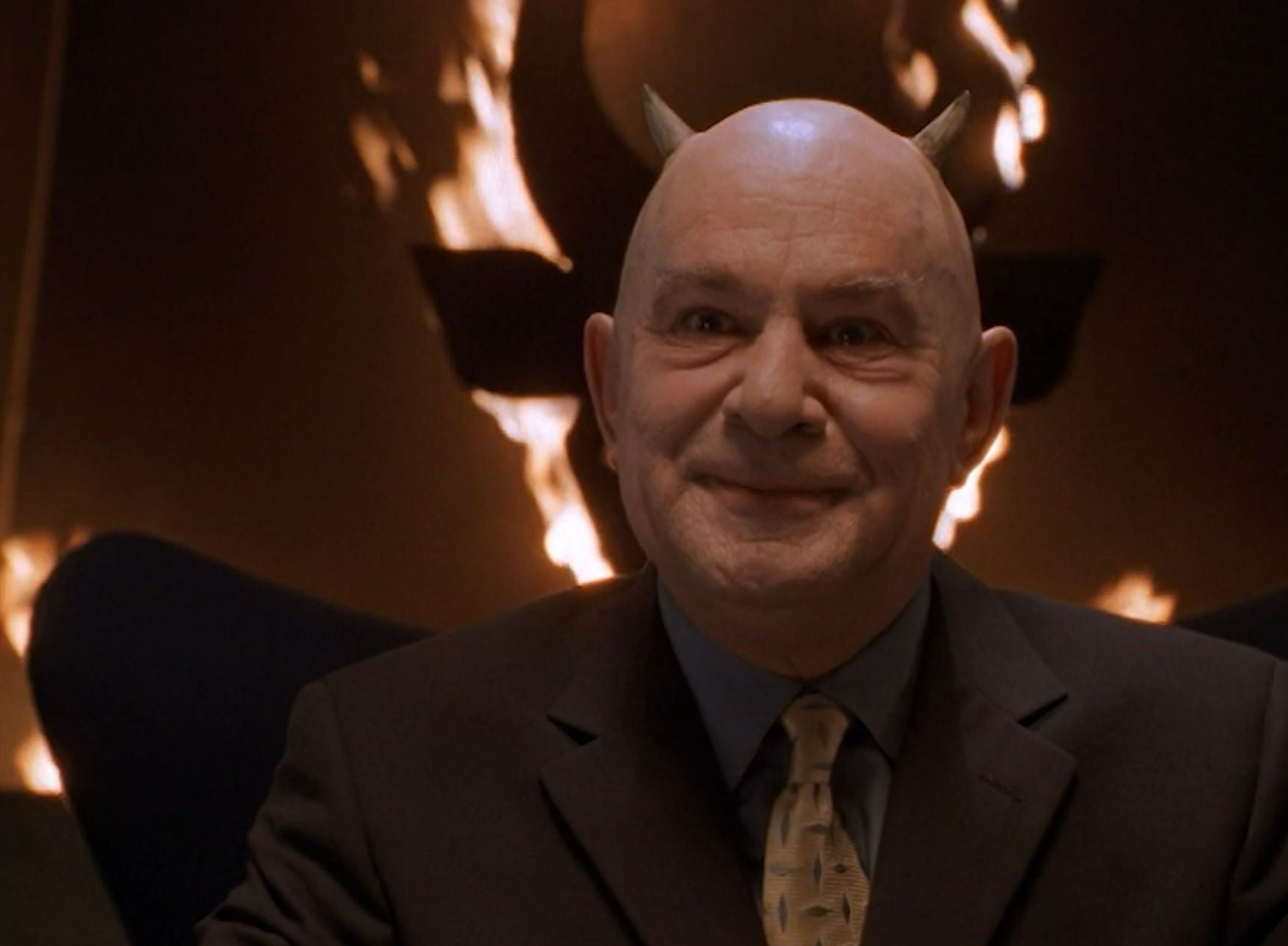 Mephisto in front of a raging fire