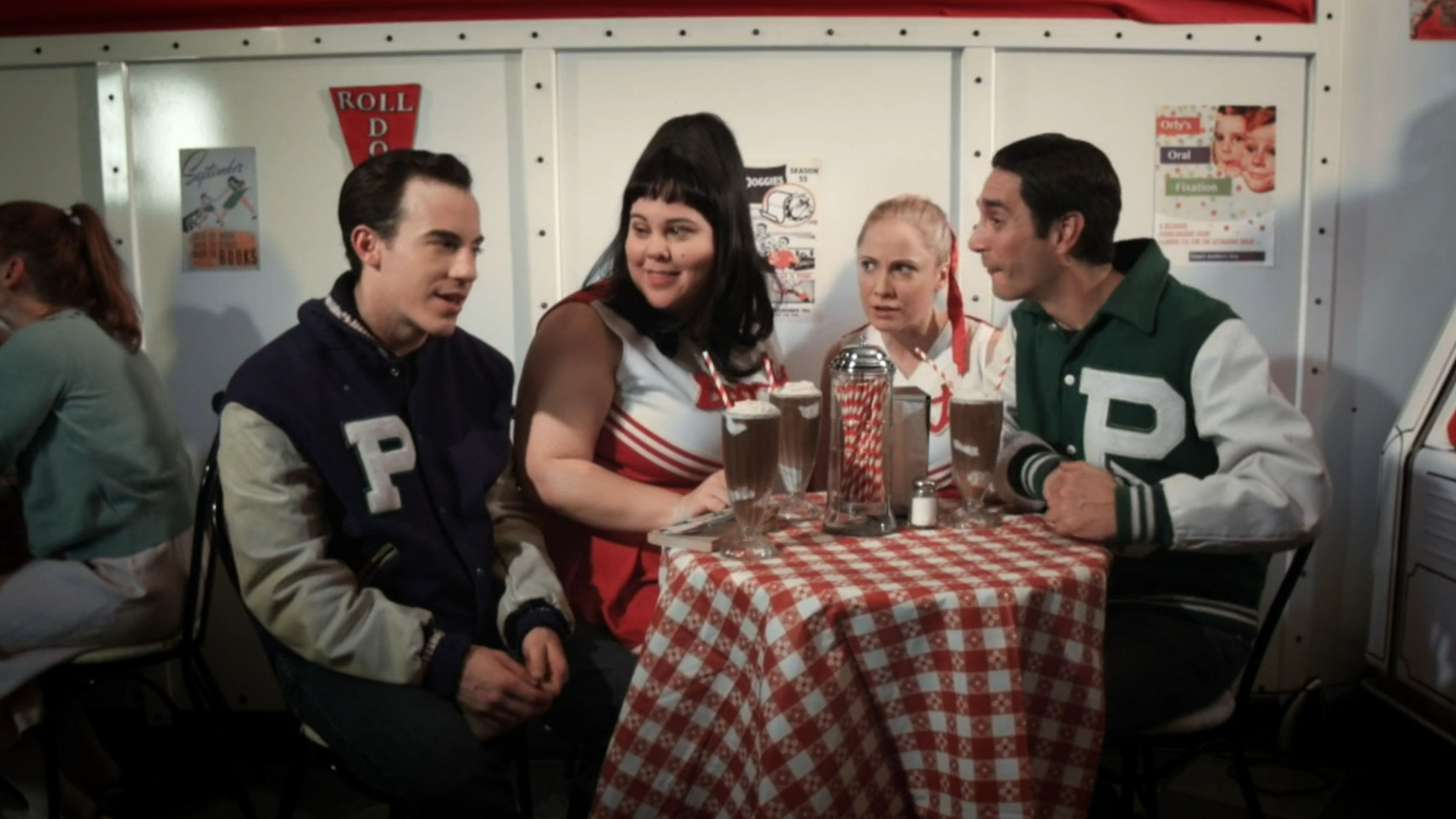 Curtis and friends sitting at the Malt Shop