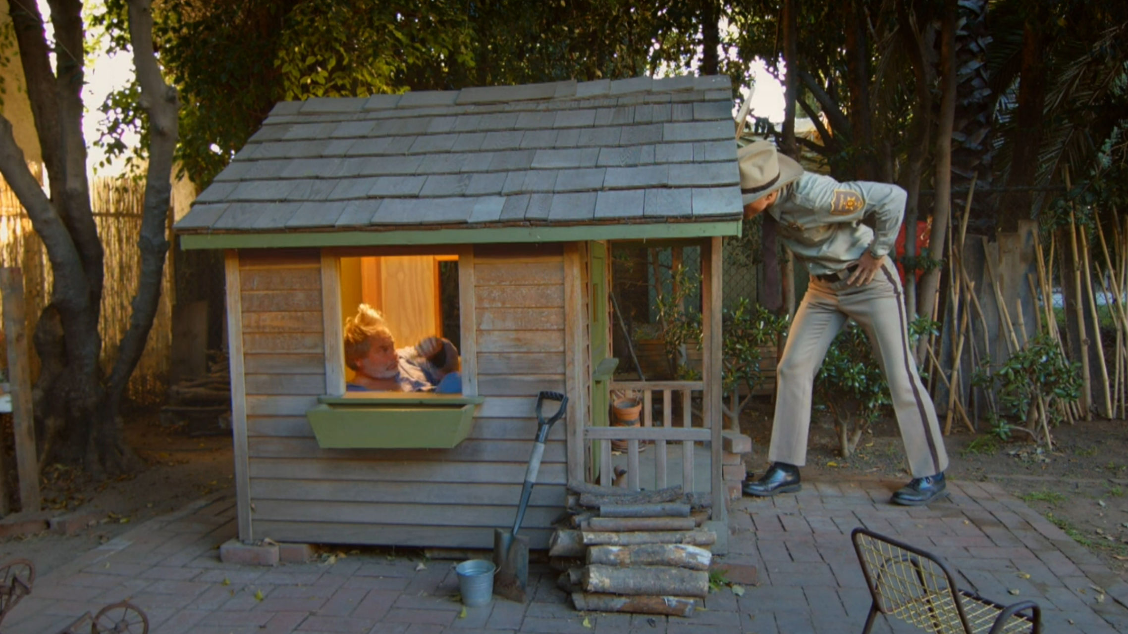 The sheriff confronts a guy in his tiny house