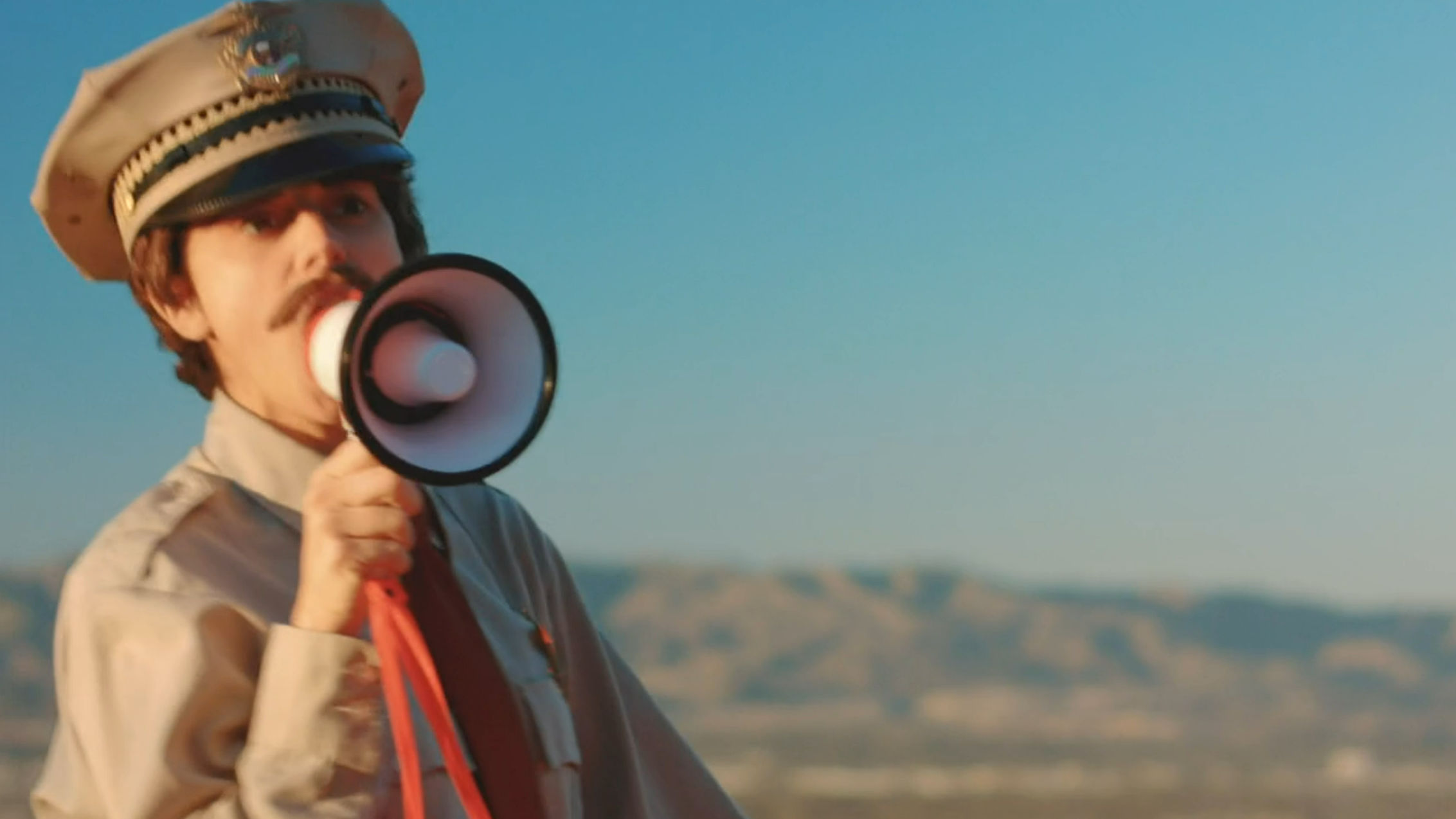 Gary being obnoxious with a megaphone