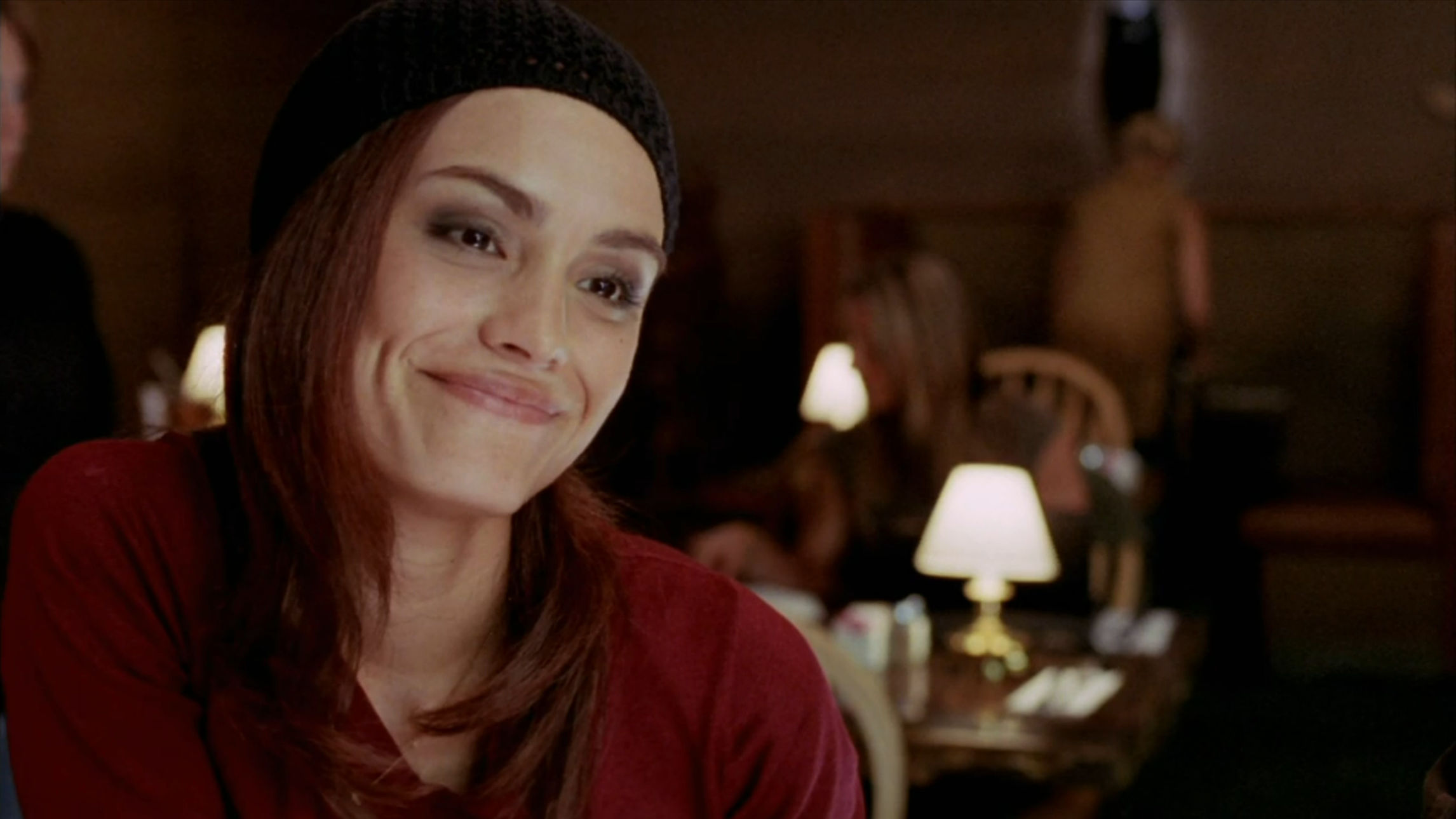 Marisol smiling in her stylish hat