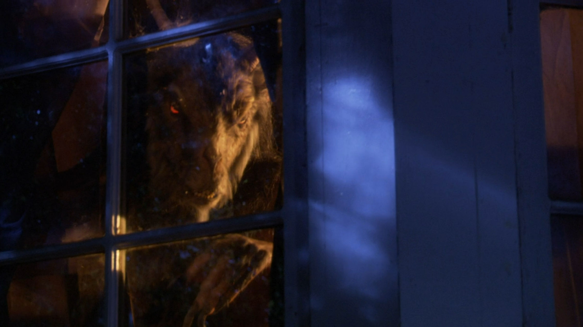 The goat guy hiding behind a curtain